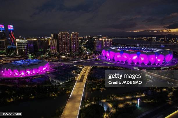 An aerial photo shows the night view of Hangzhou Olympic Sports Center Stadium and Tennis Centre which will host competition at the Asian Games in...