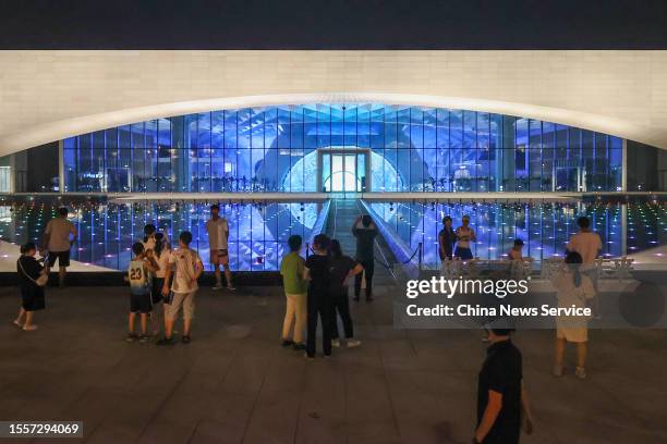 People visit Xiong'an Urban Computing Center at night on July 19, 2023 in Xiong'an New Area, Hebei Province of China.