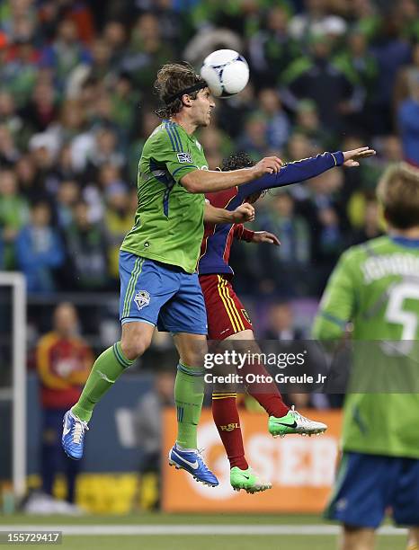 Jeff Parke of the Seattle Sounders FC heads the ball against Ned Grabavoy of Real Salt Lake at CenturyLink Field on November 2, 2012 in Seattle,...
