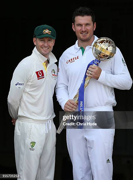 Michael Clarke of Australia and Graeme Smith of South Africa pose with the ICC Test Championship Mace during a captain's media call at The Gabba on...