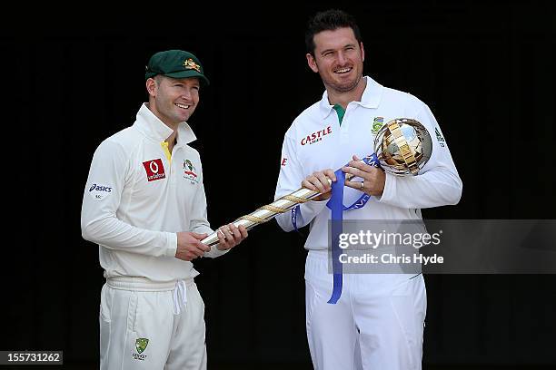 Michael Clarke of Australia and Graeme Smith of South Africa pose with the ICC Test Championship Mace during a captain's media call at The Gabba on...