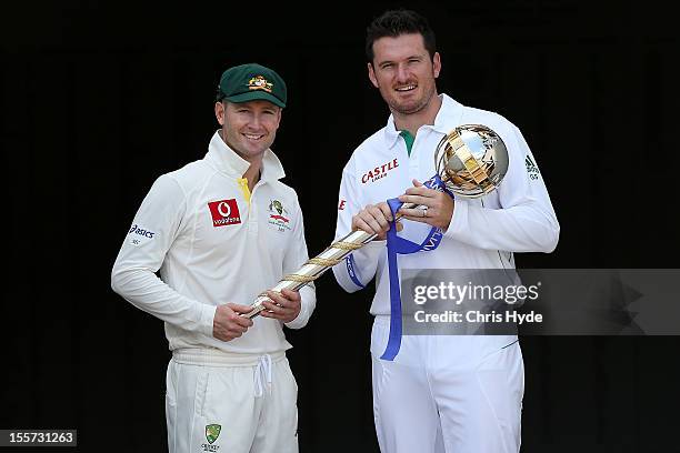 Michael Clarke of Australia and Graeme Smith of South Africa pose with the ICC Test Championship Mace during a captain's media call at The Gabba on...