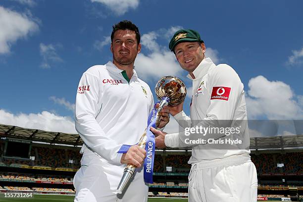 Michael Clarke of Australia and Graeme Smith of South Africa pose with the ICC Test Championship Mace during a captain's media call at The Gabba on...