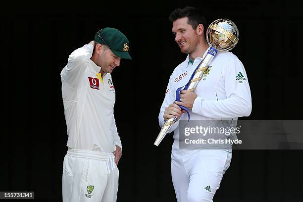 Michael Clarke of Australia and Graeme Smith of South Africa pose with the ICC Test Championship Mace during a captain's media call at The Gabba on...