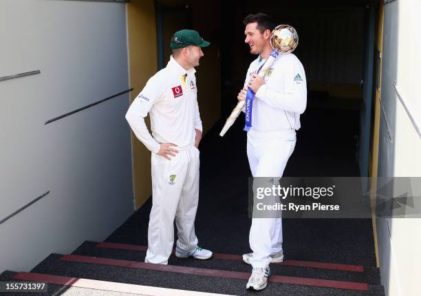 Michael Clarke of Australia and Graeme Smith of South Africa pose with the ICC Test Championship Mace during a captain's media call at The Gabba on...