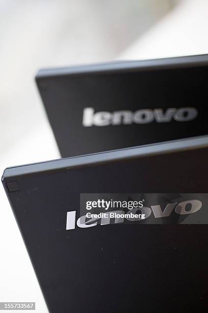 The Lenovo Group Ltd. Logos are displayed on Lenovo screens arranged for a photograph in Hong Kong, China, on Wednesday, Nov. 7, 2012. Lenovo...