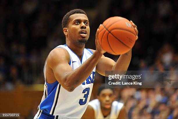 Tyler Thornton of the Duke Blue Devils concentrates at the free throw line against the Winston-Salem State Rams at Cameron Indoor Stadium on November...