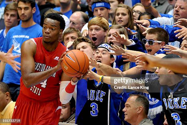 Cameron Crazies of the Duke Blue Devils try to distract Kimani Hunt of the Winston-Salem State Rams at Cameron Indoor Stadium on November 1, 2012 in...