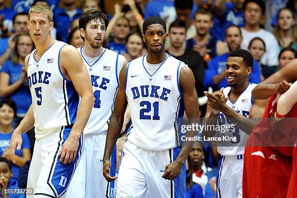 Mason Plumlee, Ryan Kelly, Amile Jefferson and Tyler Thornton of the Duke Blue Devils react following a play against the Winston-Salem State Rams at...