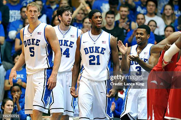 Mason Plumlee, Ryan Kelly, Amile Jefferson and Tyler Thornton of the Duke Blue Devils react following a play against the Winston-Salem State Rams at...