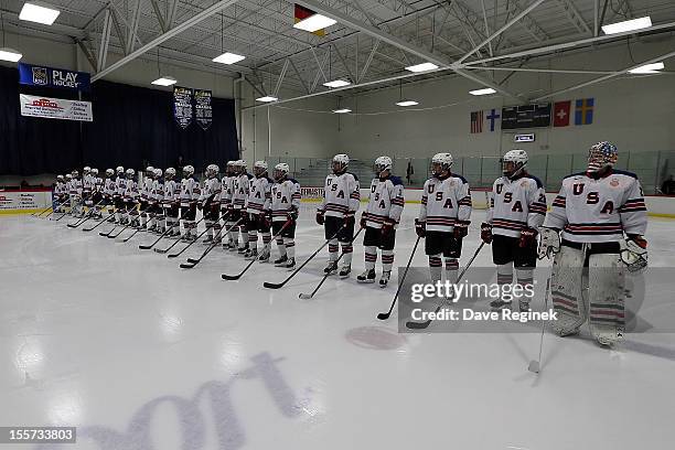 Team USA lines up on the blue line for the pre-game ceramonies before game two of the U-18 Four Nations Cup on November 7, 2012 at the Ice Cube arena...