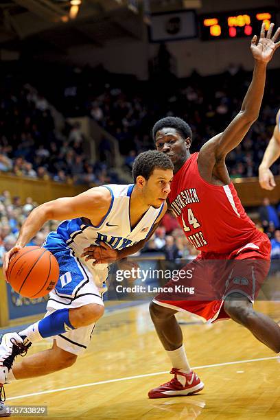 Tyre Desmore of the Winston-Salem State Rams defends Seth Curry of the Duke Blue Devils at Cameron Indoor Stadium on November 1, 2012 in Durham,...