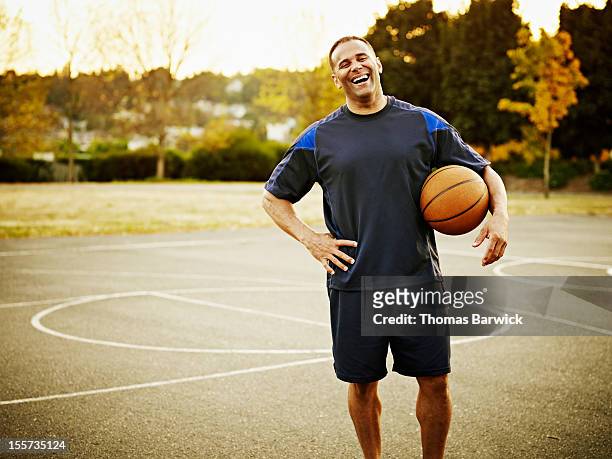 Mature basketball player standing on outdoor court