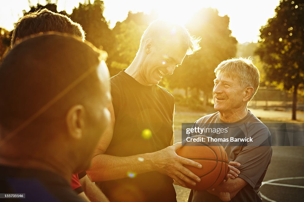 Laughing group of basketball players on court