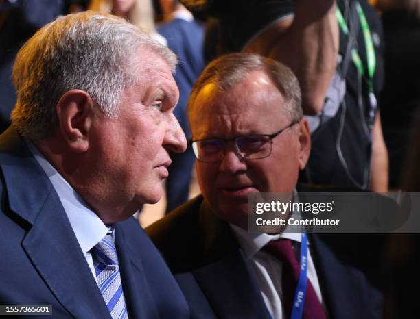 Of Rosneft Igor Sechin and President of VTB Andrey Kostin chat during a plenary session of the Second Summit Economic And Humanitarian Forum Russia...