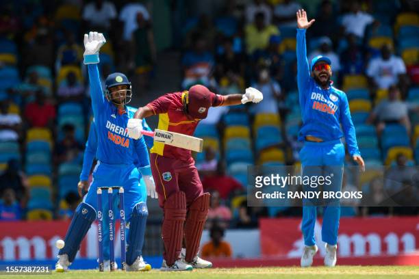 Yannic Cariah , of West Indies, lbw by Kuldeep Yadav as Ishan Kishan and Shubman Gill celebrate during the first One Day International cricket match...