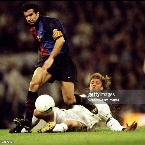 Luis Figo of Barcelona leaves Guti of Real Madrid in his wake during the Spanish Primera Liga match played at the Bernabeau Stadium in Madrid, Spain....