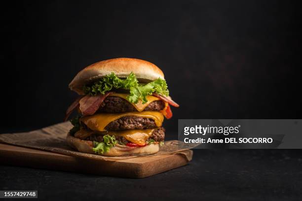 homemade cheeseburger with meat bacon salad cheese and ketchup - giant cheeseburger stock pictures, royalty-free photos & images
