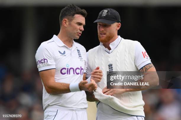 England's James Anderson speaks with England's captain Ben Stokes as he prepares to bowl on the opening day of the fifth Ashes cricket Test match...