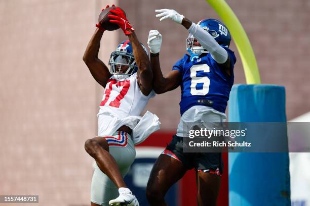 Cornerback Tre Hawkins III of the New York Giants intercepts a pass intended for wide receiver Bryce Ford-Wheaton during training camp at NY Giants...