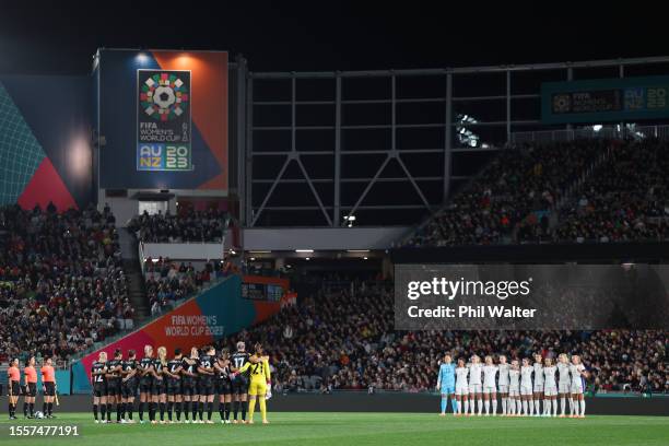 Players of New Zealand, players of Norway and match officials observe a minute of silence for victims in Auckland shooting prior to the FIFA Women's...