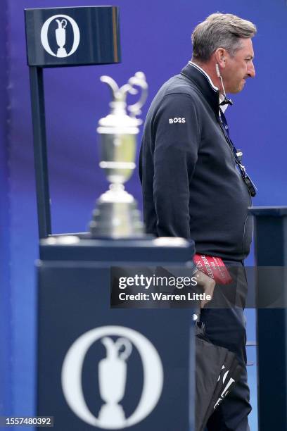 Kevin Feeney, Senior DP World Tour Referee looks over the Claret Jug trophy on the 1st tee on Day One of The 151st Open at Royal Liverpool Golf Club...