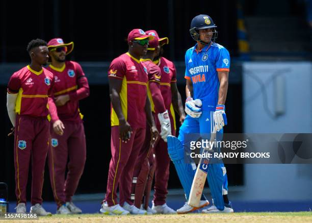Shubman Gill of India walks off the field dismissed by Jayden Seales of West Indies during the first One Day International cricket match between West...