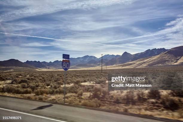 route 80 as viewed from the interior of a moving vehicle heading east  nevada usa - nevada landscape stock pictures, royalty-free photos & images