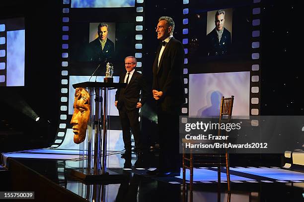 Director Steven Spielberg presents honoree Daniel Day-Lewis with the Stanley Kubrick Britannia Award for Excellence in Film onstage at the 2012 BAFTA...