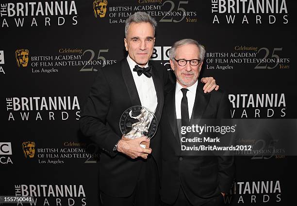 Honoree Daniel Day-Lewis and director Steven Spielberg pose with The Stanley Kubrick Britannia Award for Excellence in Film backstage at the 2012...