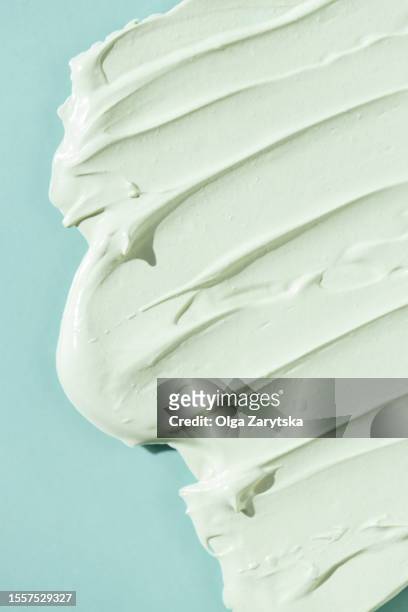 cosmetic cream or scrub on turquoise background. - beauty treatment fotografías e imágenes de stock
