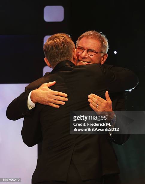 Actor Harrison Ford presents honoree Daniel Craig with the Britannia Award for British Artist of the Year onstage at the 2012 BAFTA Los Angeles...