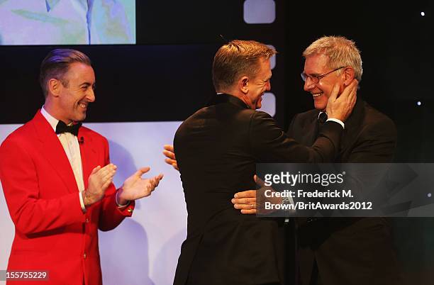 Alan Cumming and Harrison Ford present the Britannia Award for British Artist of the Year to Honoree Daniel Craig onstage at the 2012 BAFTA Los...