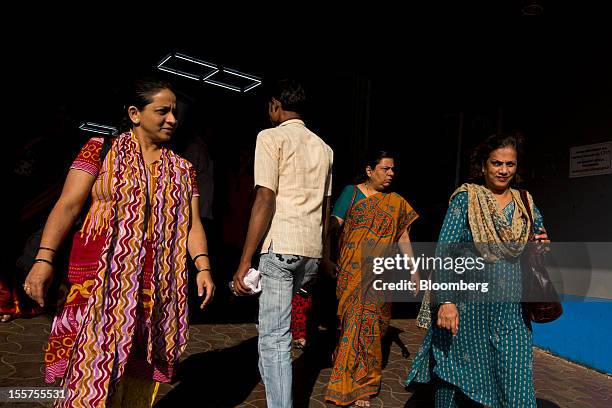 Morning commuters exit a railway station in Mumbai, India, on Tuesday, Nov. 6, 2012. Reserve Bank of India Governor Duvvuri Subbarao lowered the...