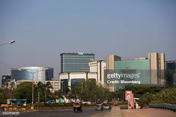 Traffic moves in front of the Wockhardt Ltd. Headquarters, right, in the Bandra Kurla Complex in Mumbai, India, on Tuesday, Nov. 6, 2012. Reserve...
