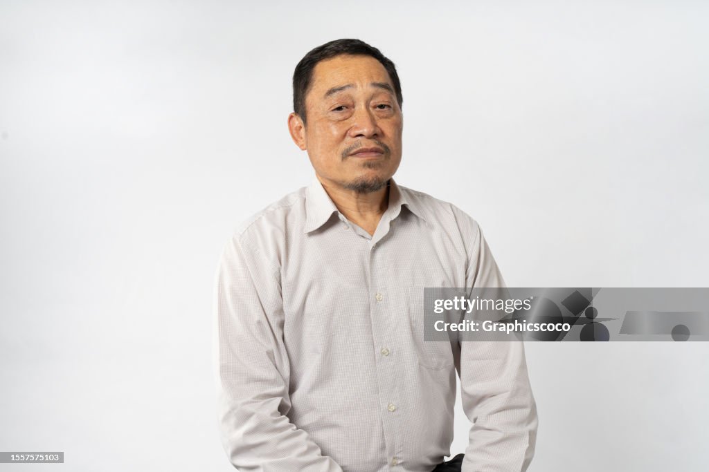 Portrait Asian Mature Man Showing Expression and Emotion on Face in studio