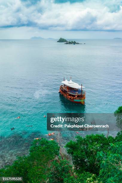 tourists are enjoy snorkeling underwater at koh yak lek (island near koh chang in trat, thailand) - koh chang stock pictures, royalty-free photos & images