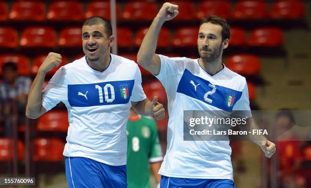 Marco Ercolessi of Italy celebrates with team mate Jairo dos Santos after scoring his teams second goal during the FIFA Futsal World Cup Group D...