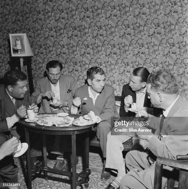 Mafia boss Charles 'Lucky' Luciano with society photographer Slim Aarons while Luciano was in exile in Sicily, Italy, 31 December 1948.