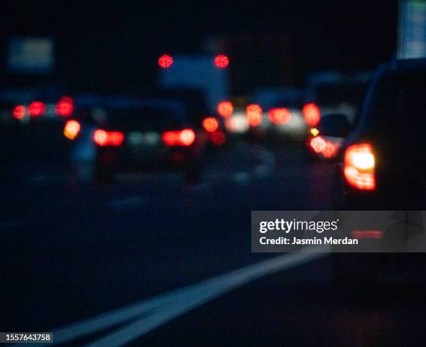 blurry traffic car lights - tail light stock pictures, royalty-free photos & images