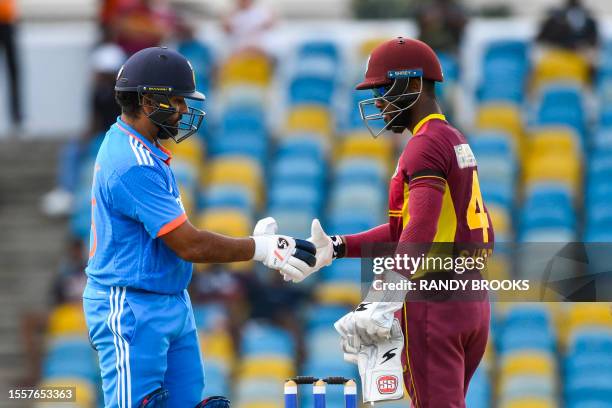 Shai Hope of West Indies congratulates Rohit Sharma of India for winning the first One Day International cricket match between West Indies and India,...