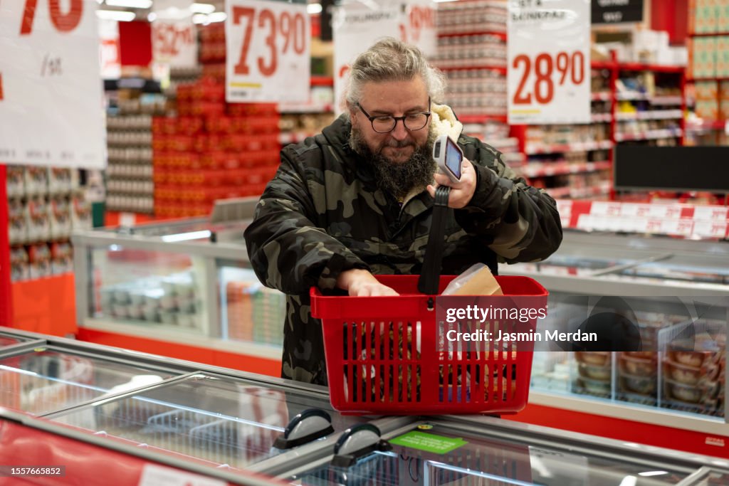 Scandinavian Man Shopping At Supermarket High-Res Stock Photo - Getty ...