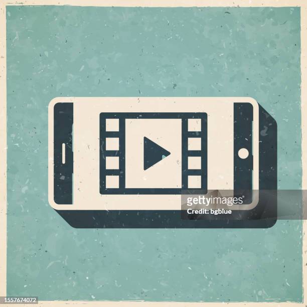 watch video on smartphone. icon in retro vintage style - old textured paper - netflix stock illustrations