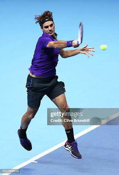 Roger Federer of Switzerland hits a forehand during the men's singles match against David Ferrer of Spain on day four of the ATP World Tour Finals at...