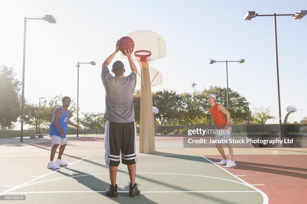 Friends playing basketball