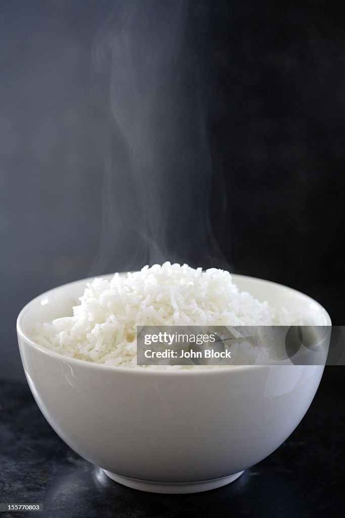 Steaming bowl of cooked rice