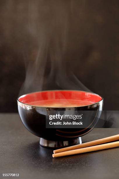 steaming bowl of miso soup - misosuppe stock-fotos und bilder