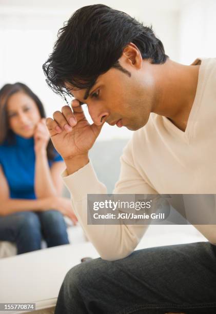 mixed race couple having an argument - angry couple arab stock pictures, royalty-free photos & images