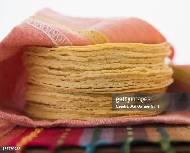 stack of corn tortillas - tortilla stock pictures, royalty-free photos & images