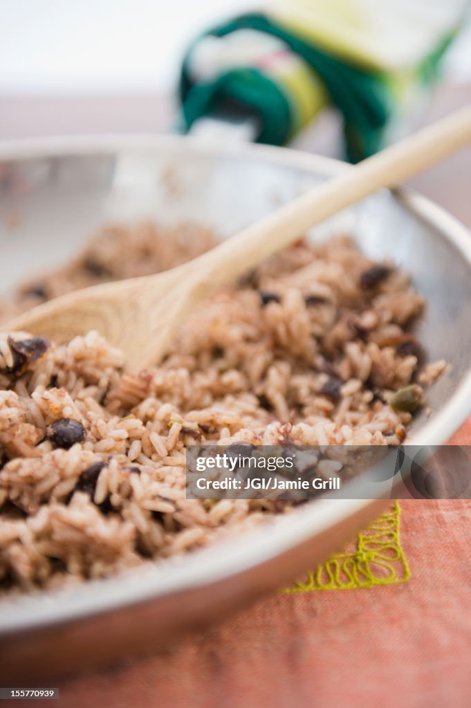 Rice and beans cooking in skillet